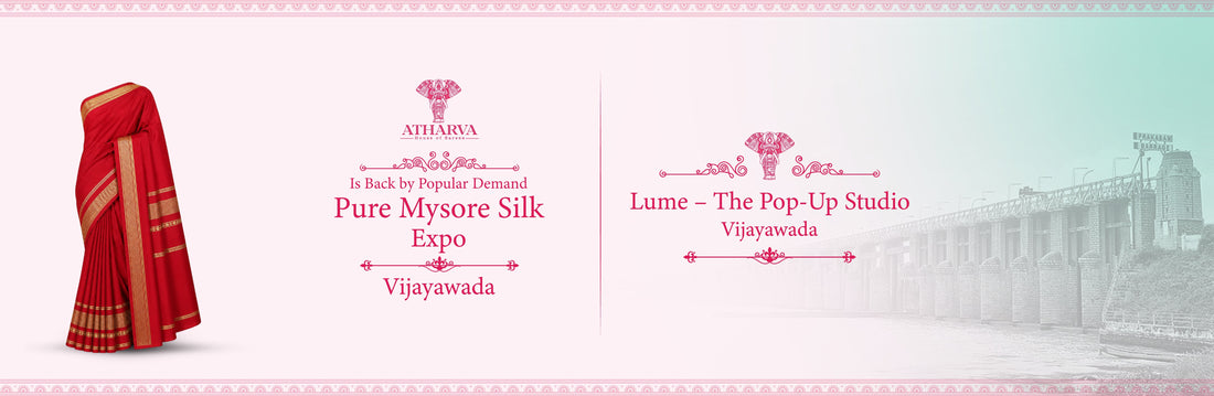 Promotional banner for Atharva House of Sarees announcing the Pure Mysore Silk Expo at Lume – The Pop-Up Studio in Vijayawada, featuring a traditional red Mysore silk saree and the iconic Prakasam Barrage backdrop.