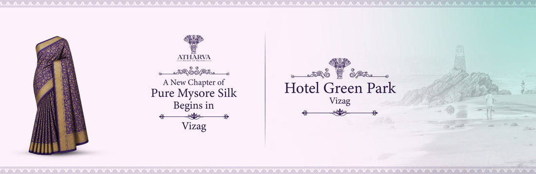 Promotional banner for Atharva House of Sarees announcing the Pure Mysore Silk Expo at Hotel Green Park, Vizag, featuring a purple Mysore silk saree and the scenic RK Beach memorial backdrop.