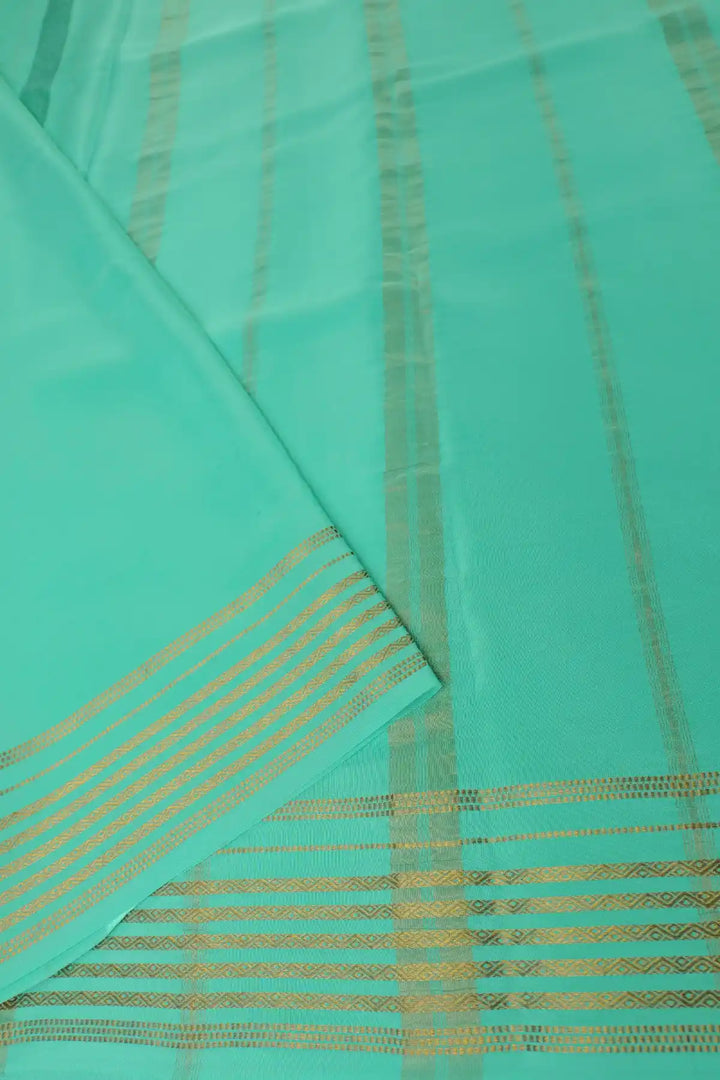 Black Mysore silk saree with mint green border and gold zari