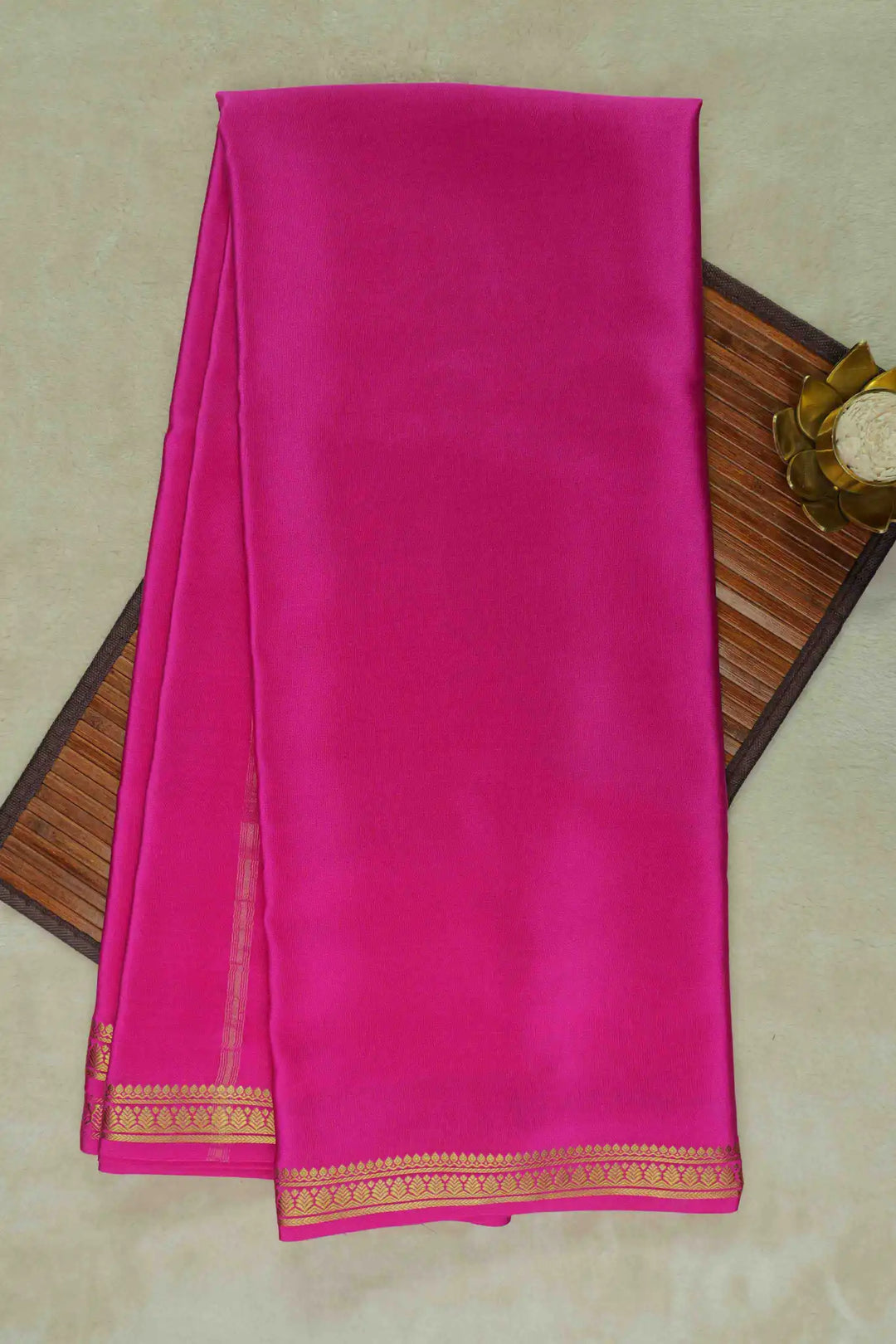 Bright pink Mysore Silk Saree with golden zari border 