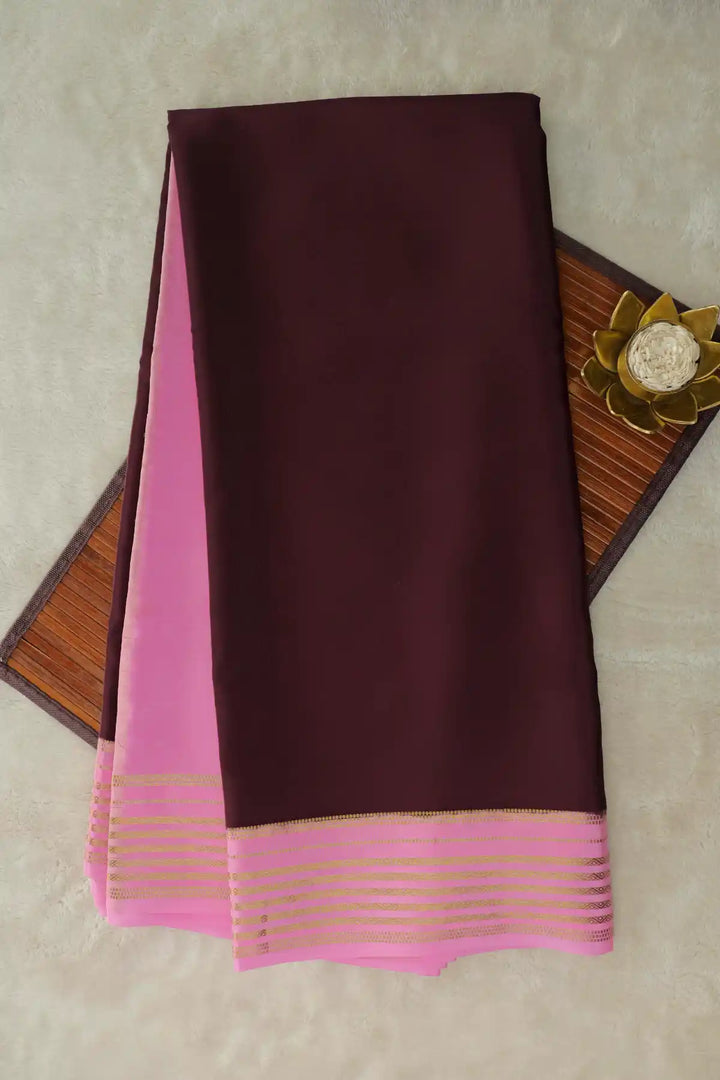 Brown saree with pink border