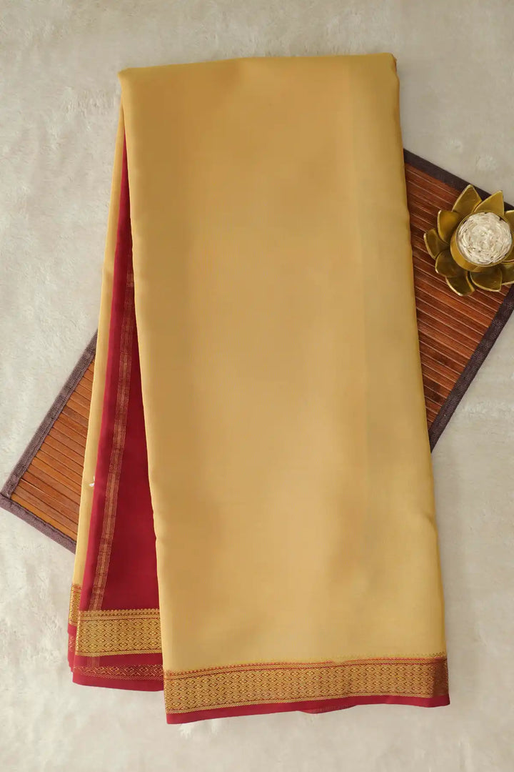 Cream yellow silk saree with maroon contrast border