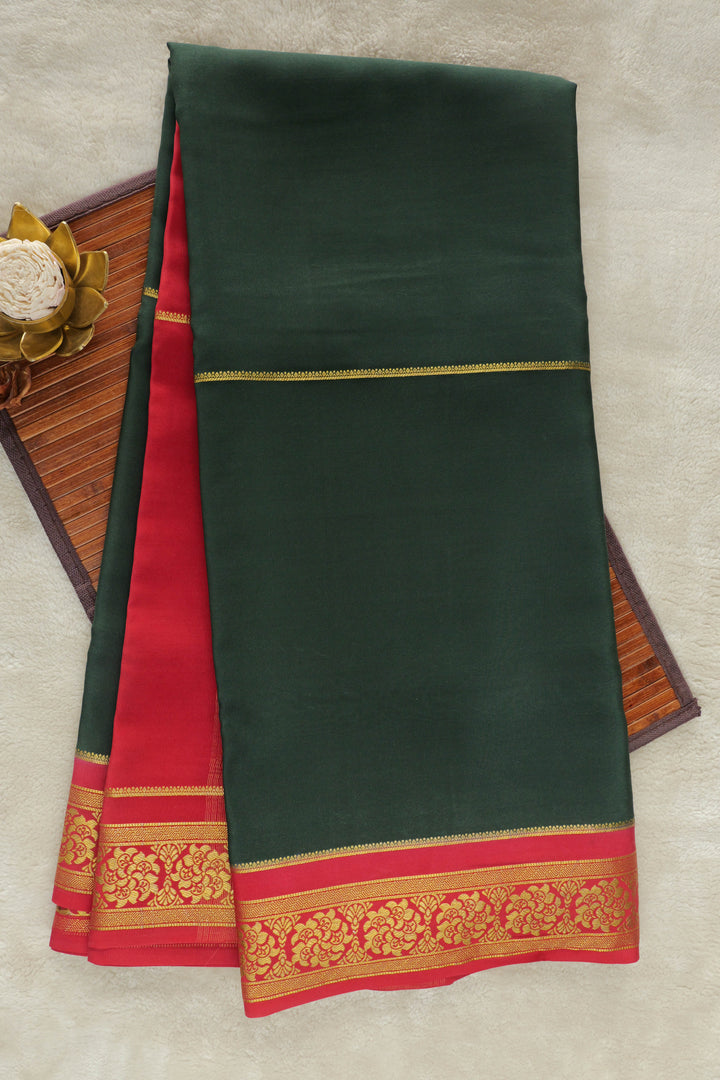 Dark green Mysore silk saree with vibrant red border