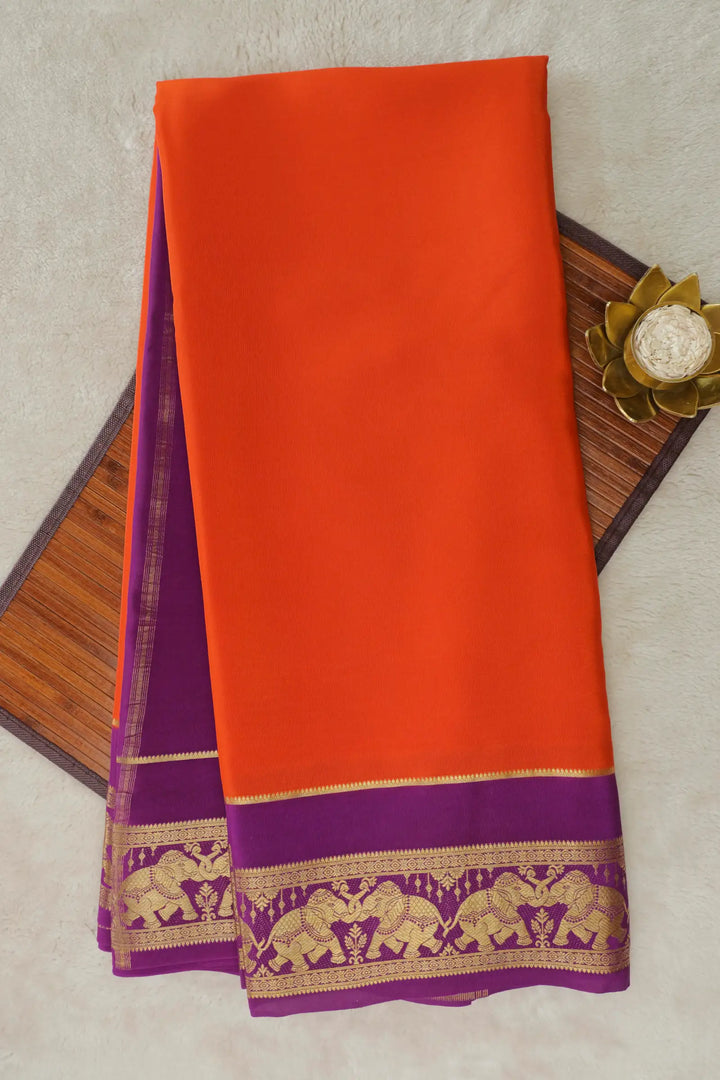 Elephant Border Mysore Crepe Silk Saree in Orange and Purple Color with Contrast Purple Blouse