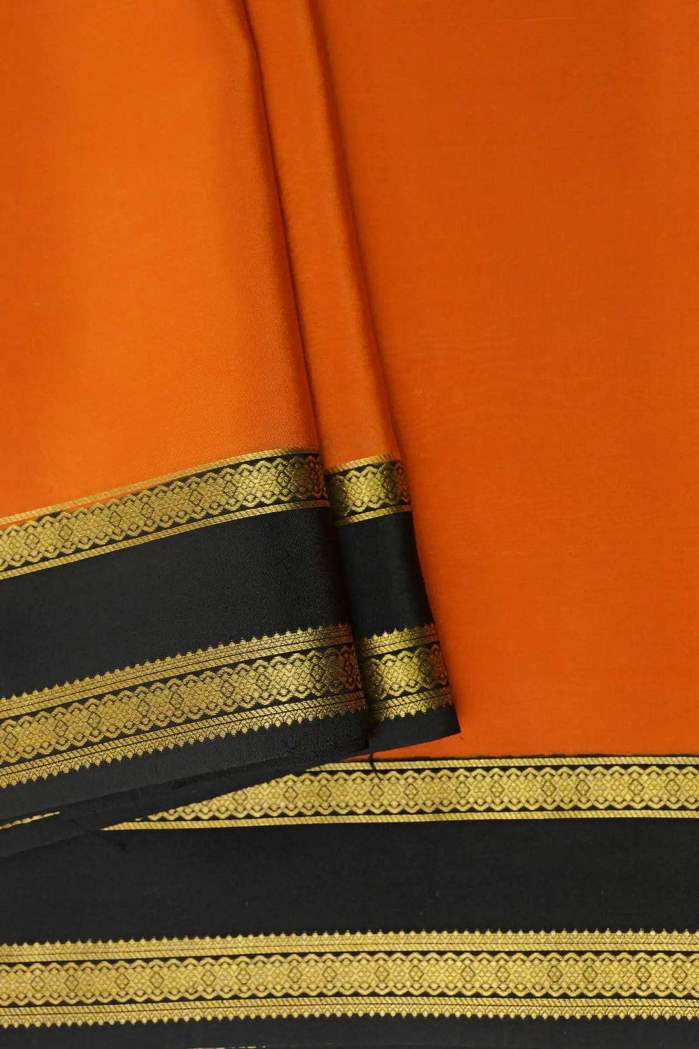 Gold Lace Mysore Silk Saree In Orange With Black Border