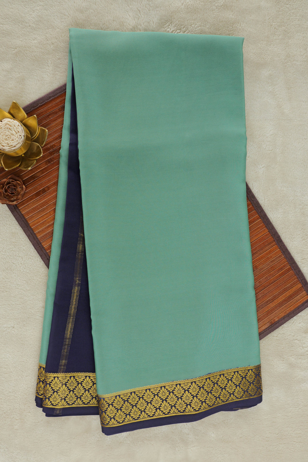 Green Mysore silk saree with navy blue border and golden zari design