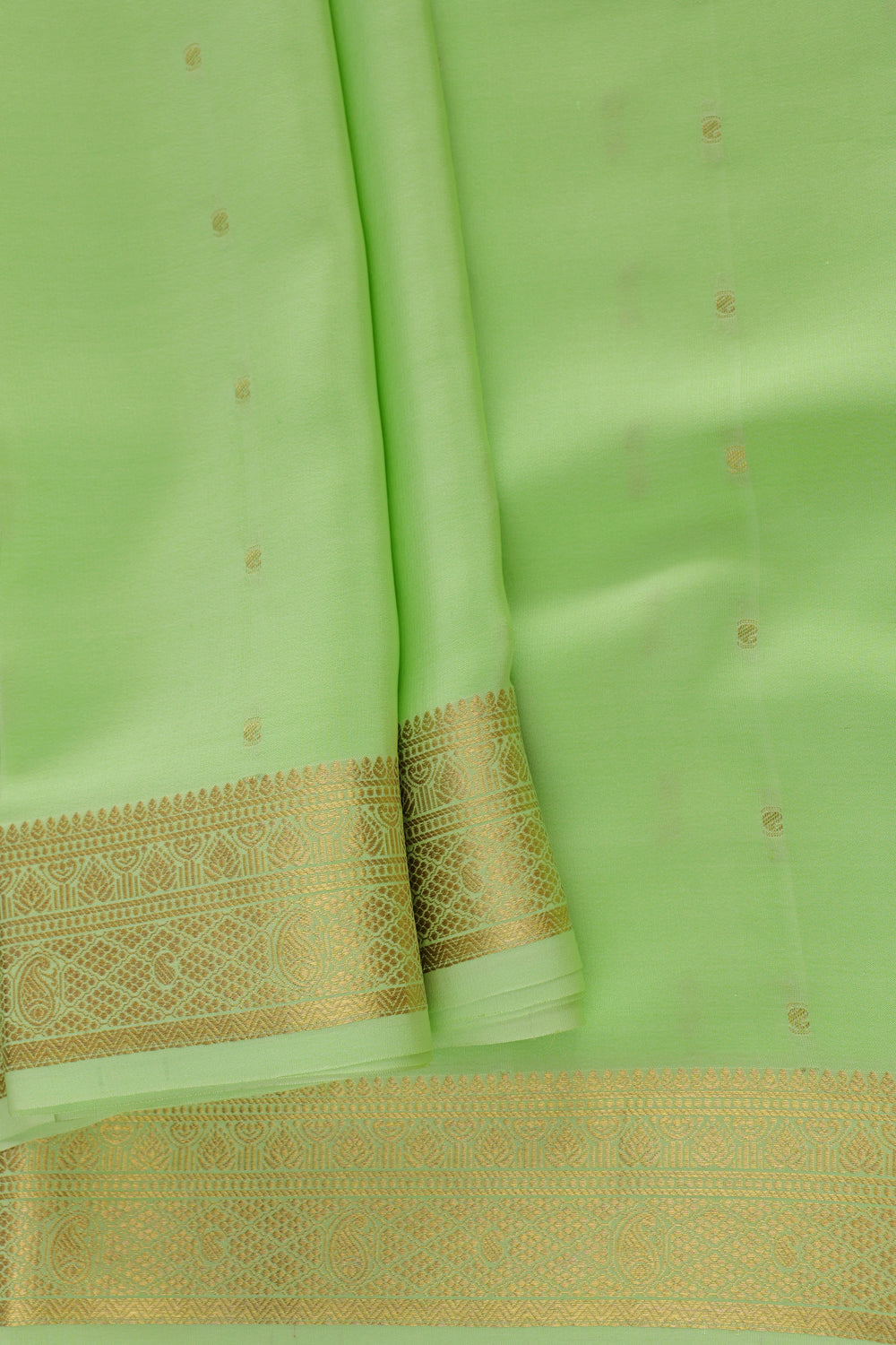 Green saree with detailed gold border design