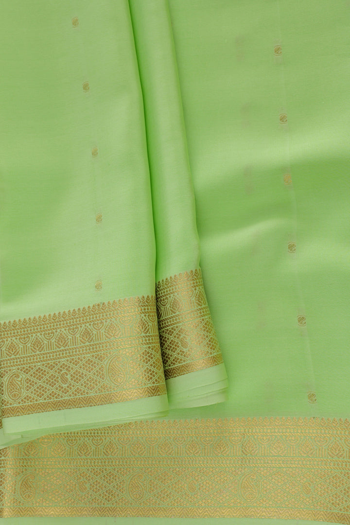Green saree with detailed gold border design