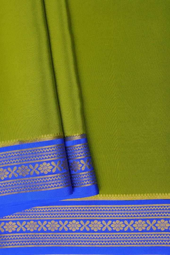 Green silk saree with contrast blue border