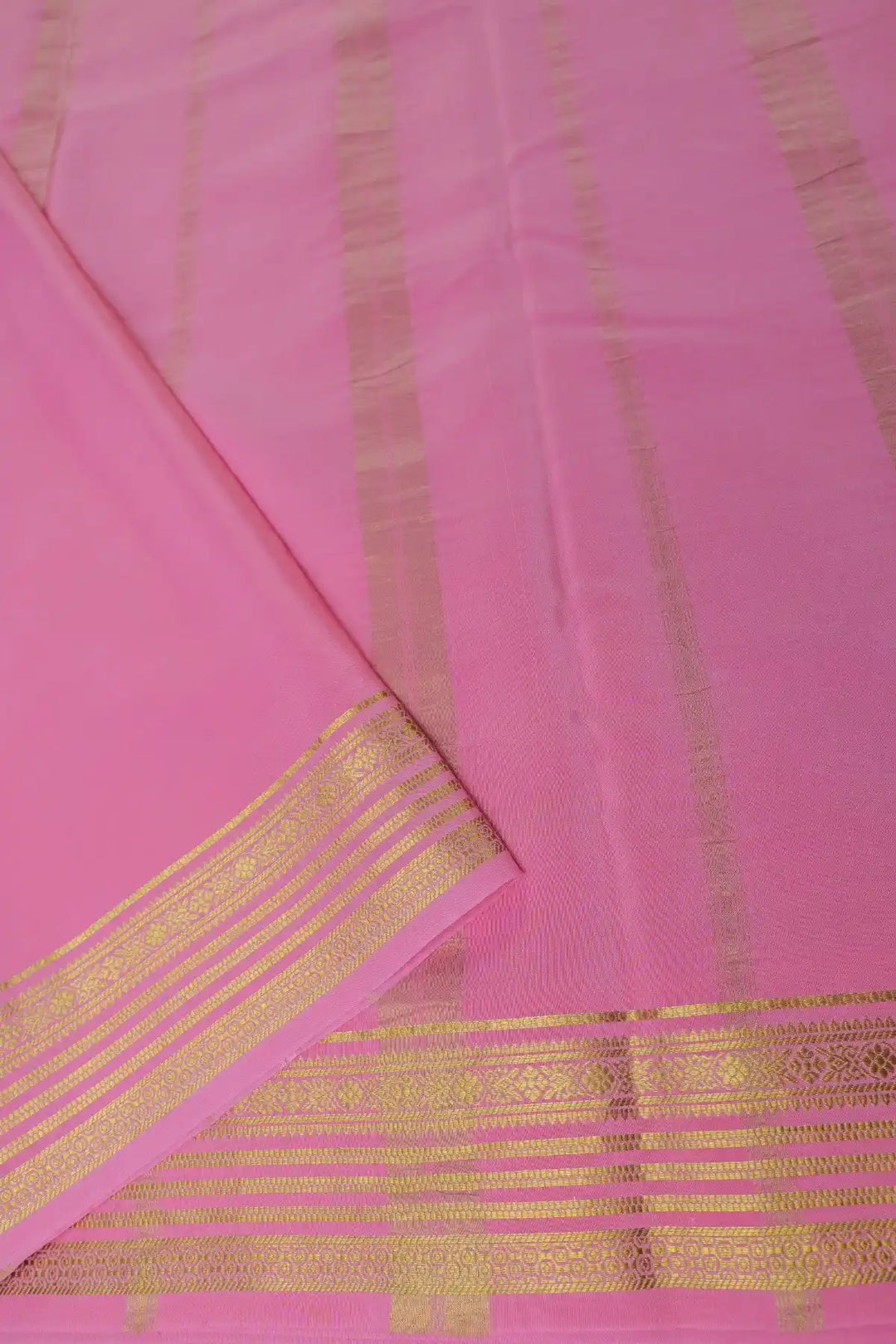 Green silk saree with contrast pink border
