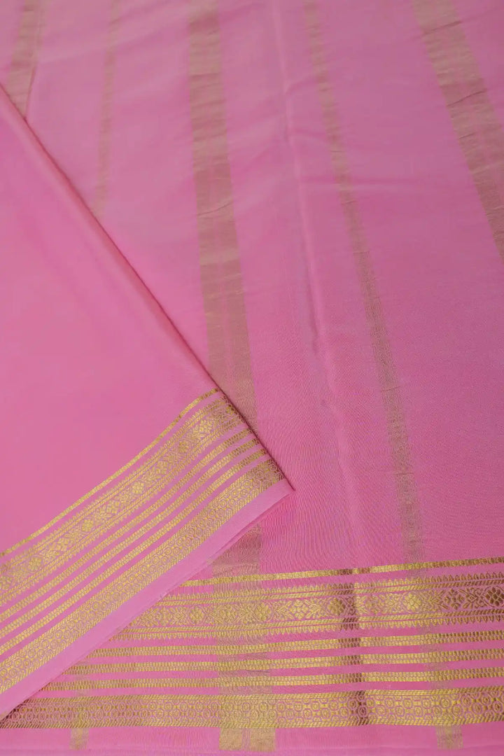 Green silk saree with contrast pink border
