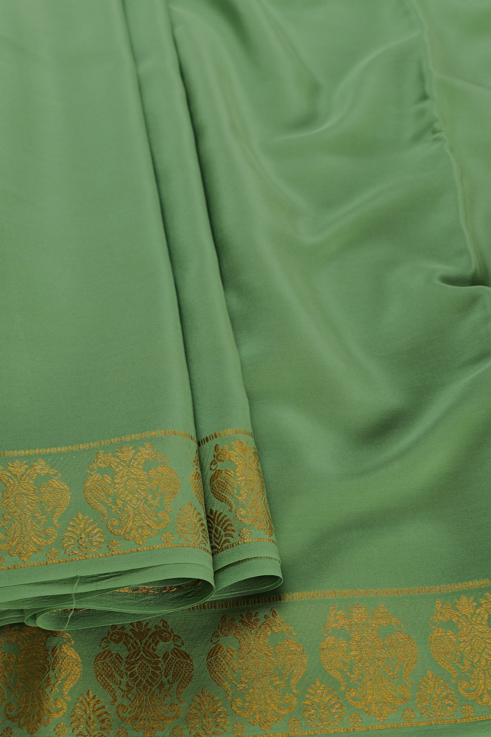 Light green Mysore silk saree with gold gandaberunda border