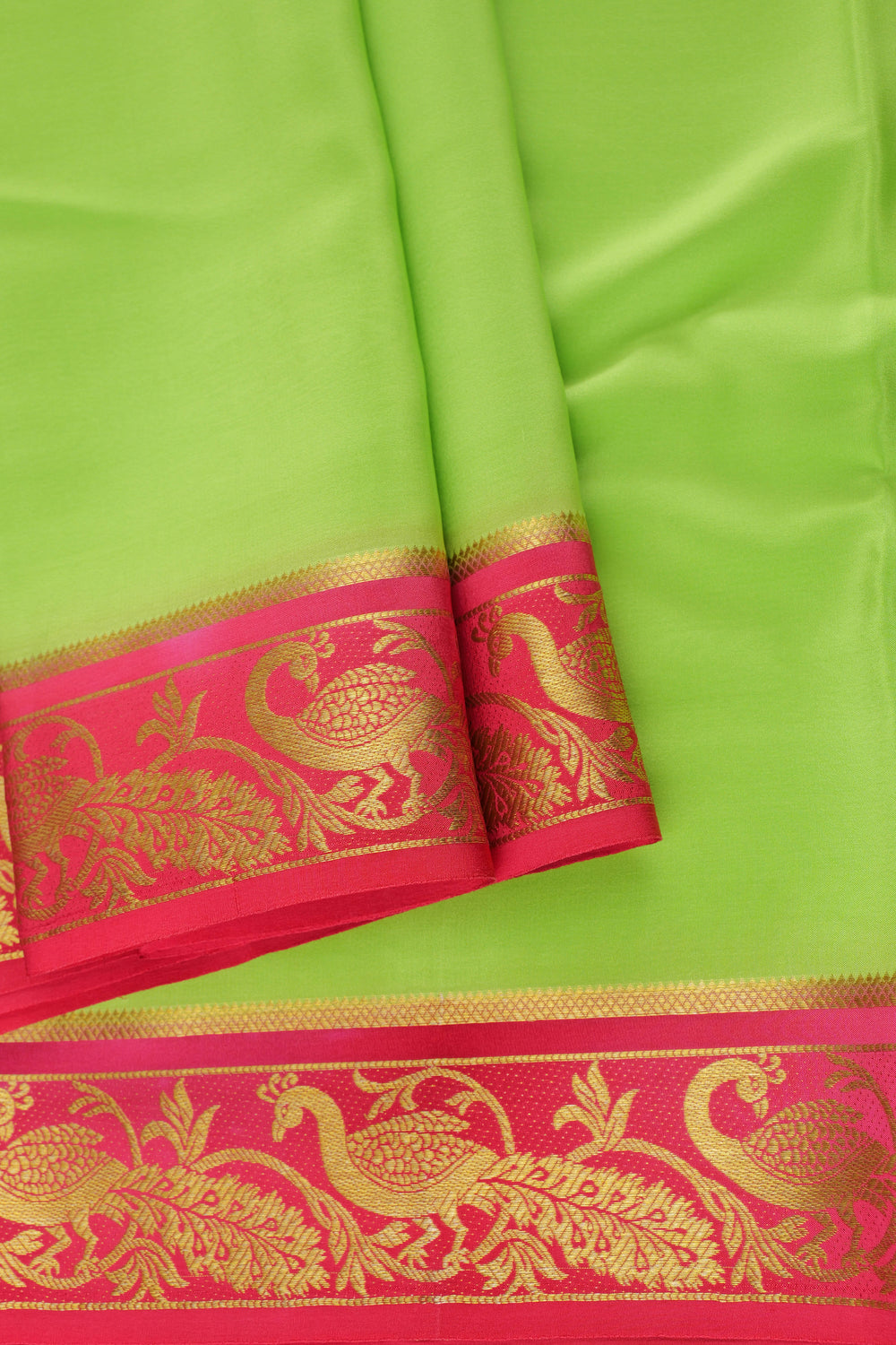 Light green Mysore silk saree with red border and gold zari peacock design