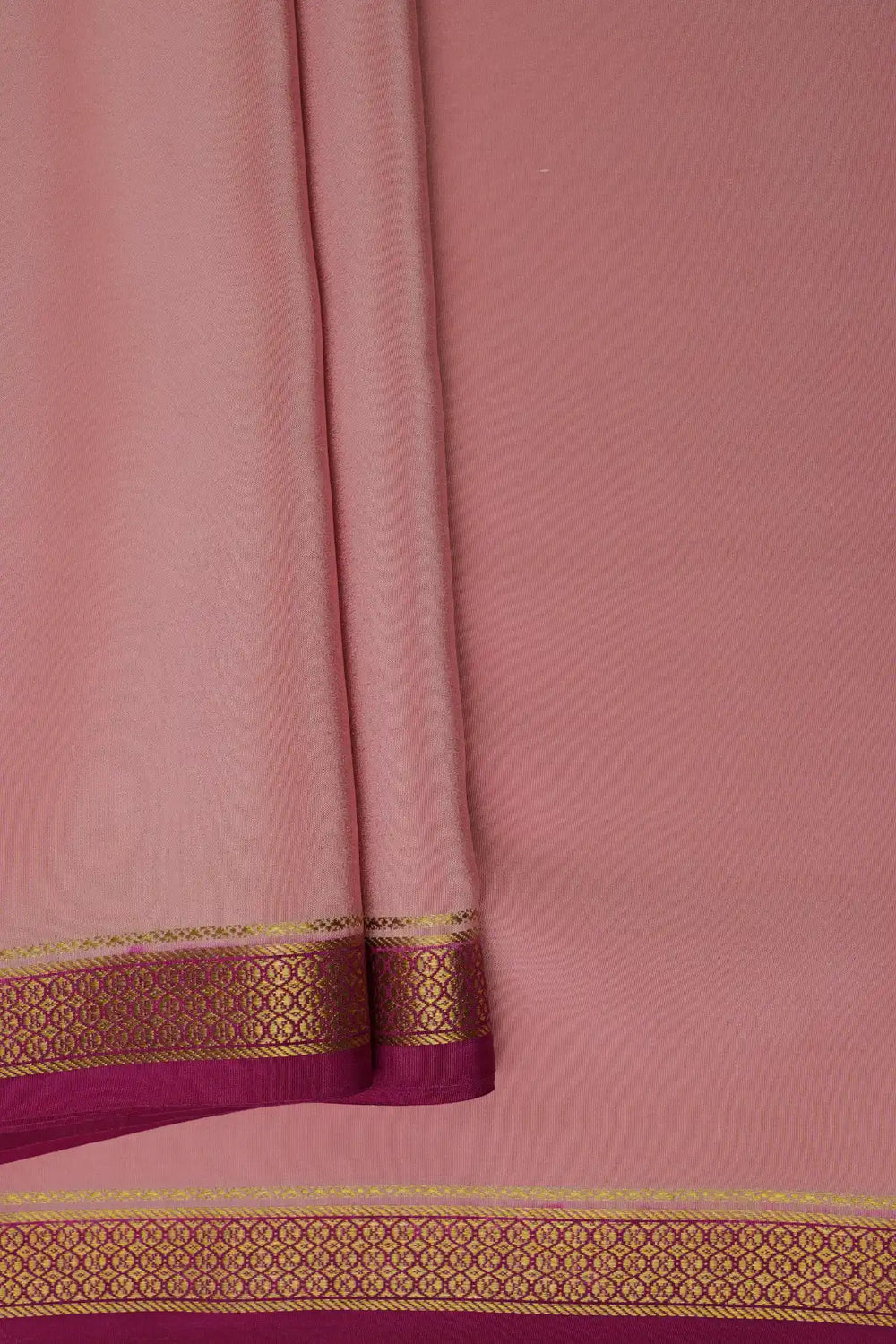 Light pink silk saree with golden lace border