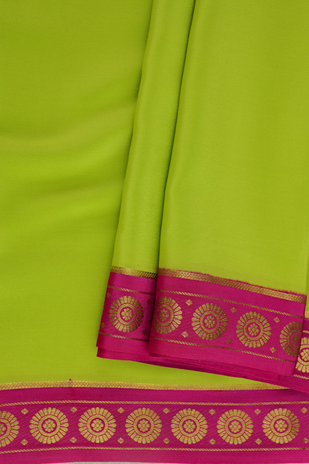 Lime yellow Mysore crepe silk saree with bright pink border and patterns
