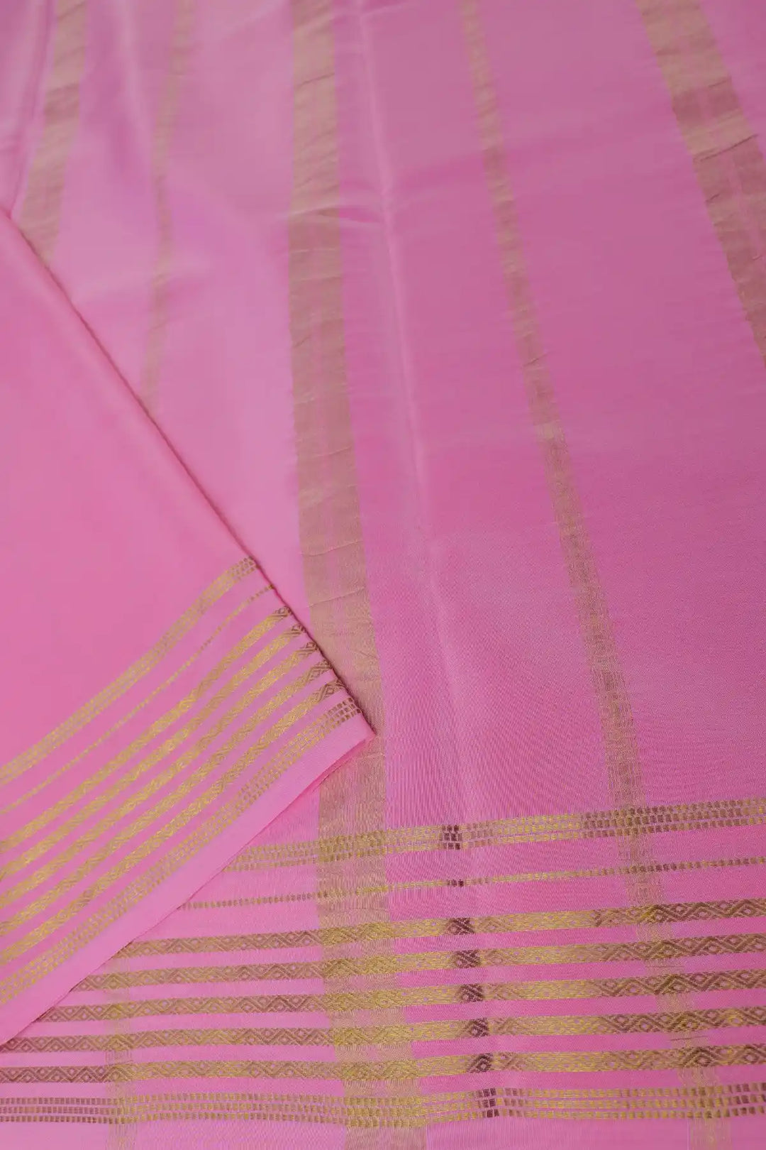 Maroon Mysore silk saree with pink border and gold zari