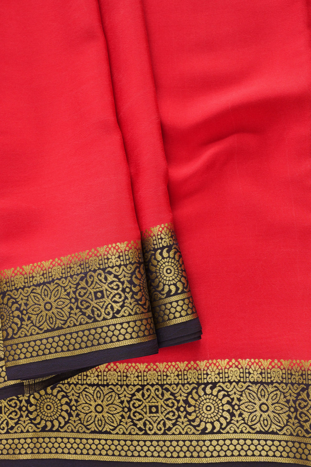 Mysore Silk Saree showcasing a rich red body, detailed black and gold border design
