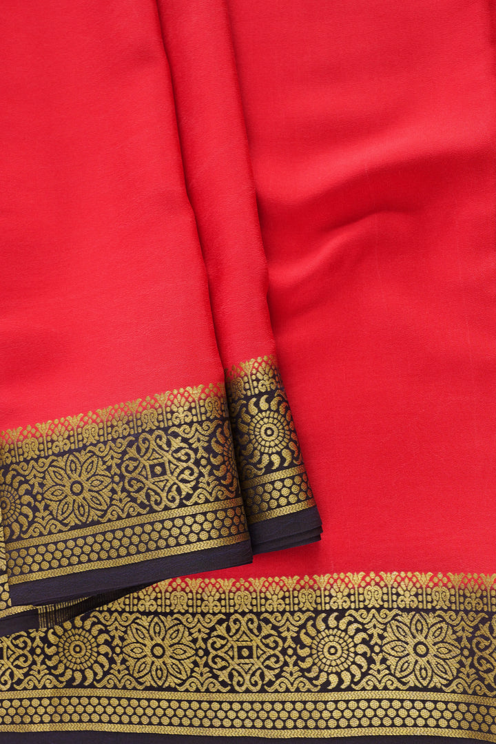 Mysore Silk Saree showcasing a rich red body, detailed black and gold border design