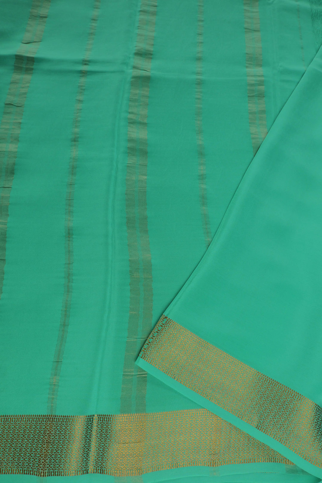 Mysore crepe silk saree in green with gold detailing pallu