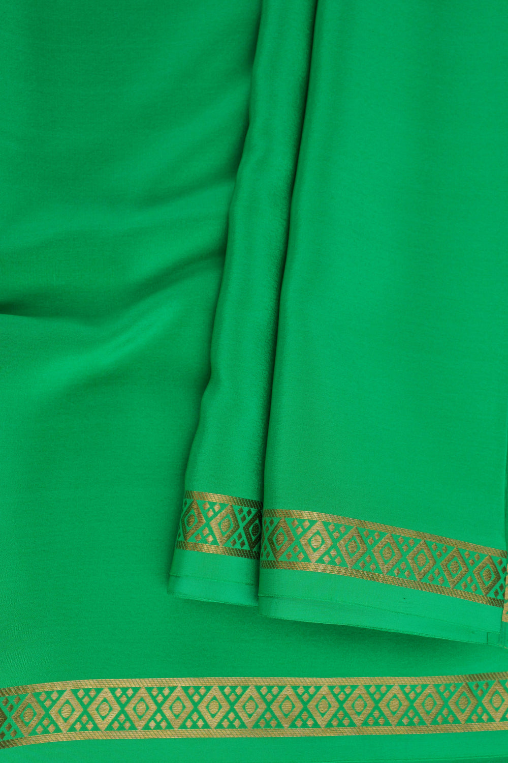 Mysore crepe silk saree in green with golden border detailing