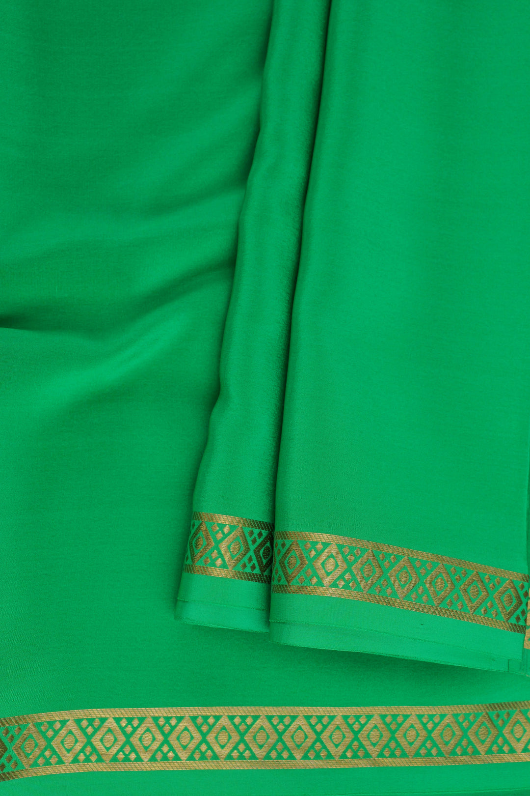 Mysore crepe silk saree in green with golden border detailing