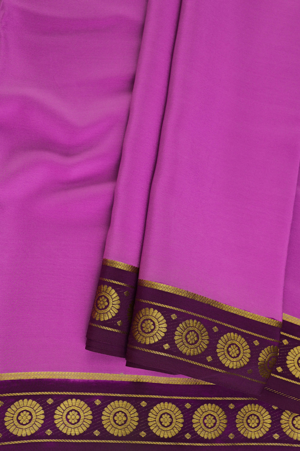 Mysore crepe silk saree in light magenta shade with traditional gold woven border