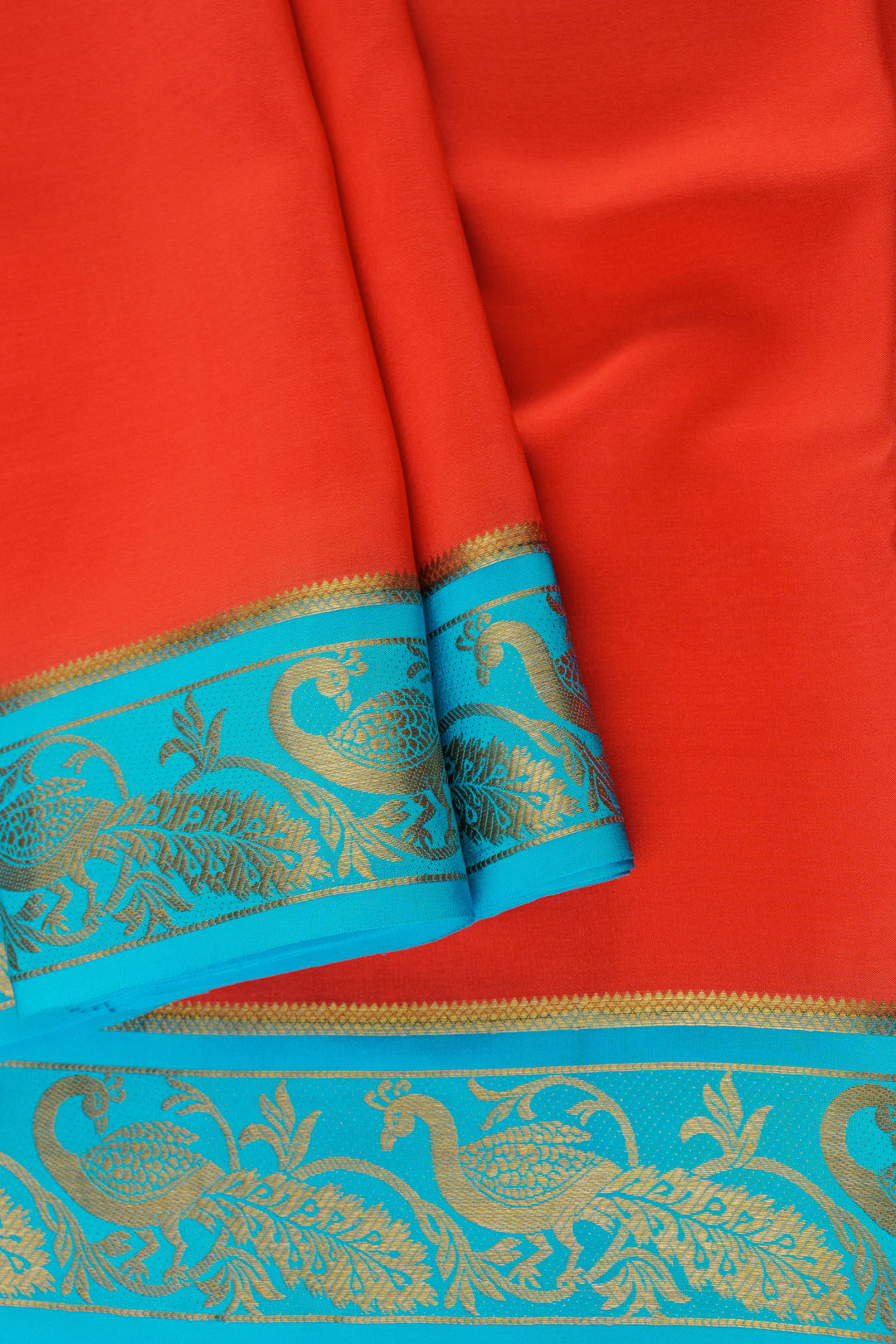Mysore crepe silk saree in red and blue combination with detailed gold zari work