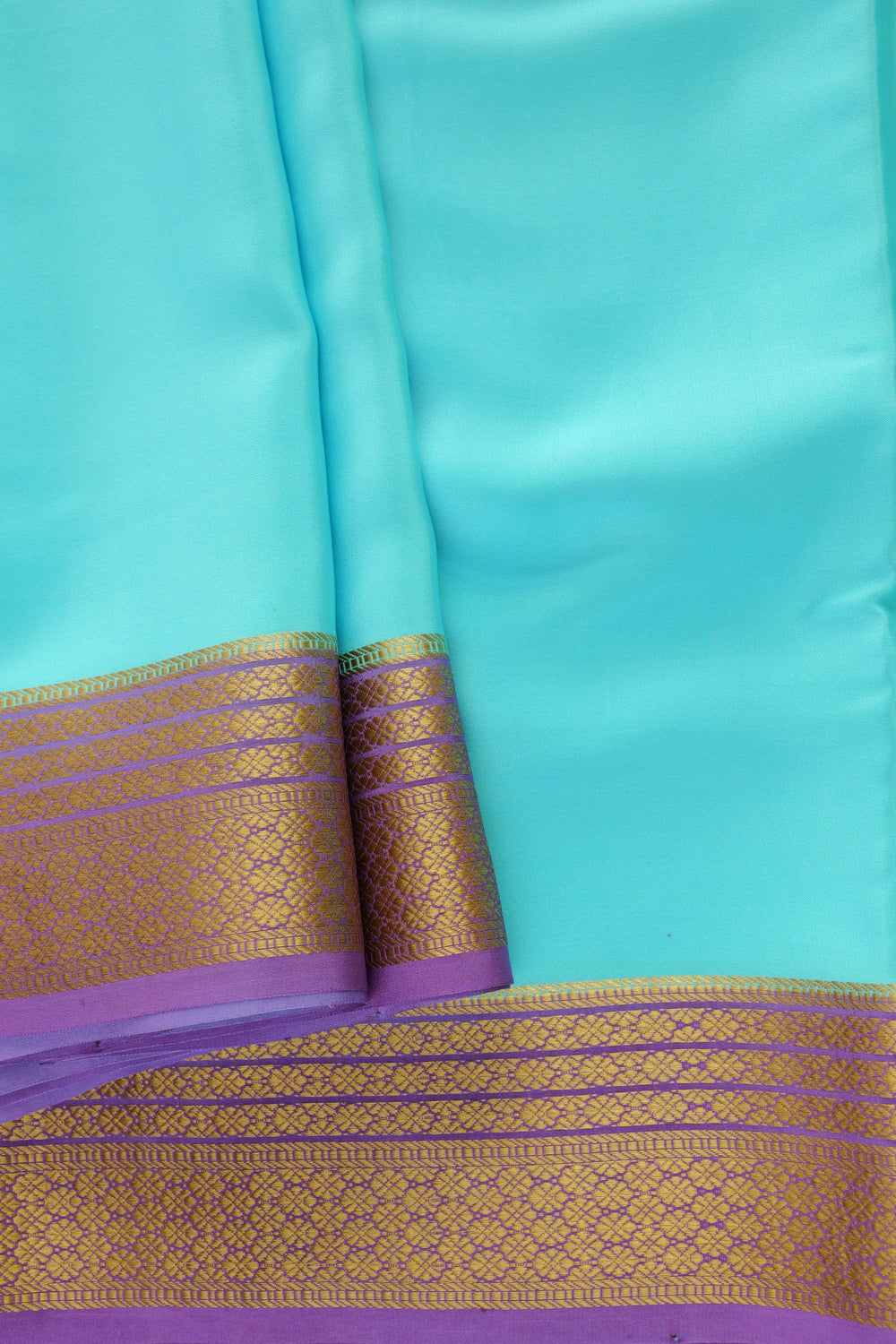 Mysore silk saree featuring purple contrast blouse