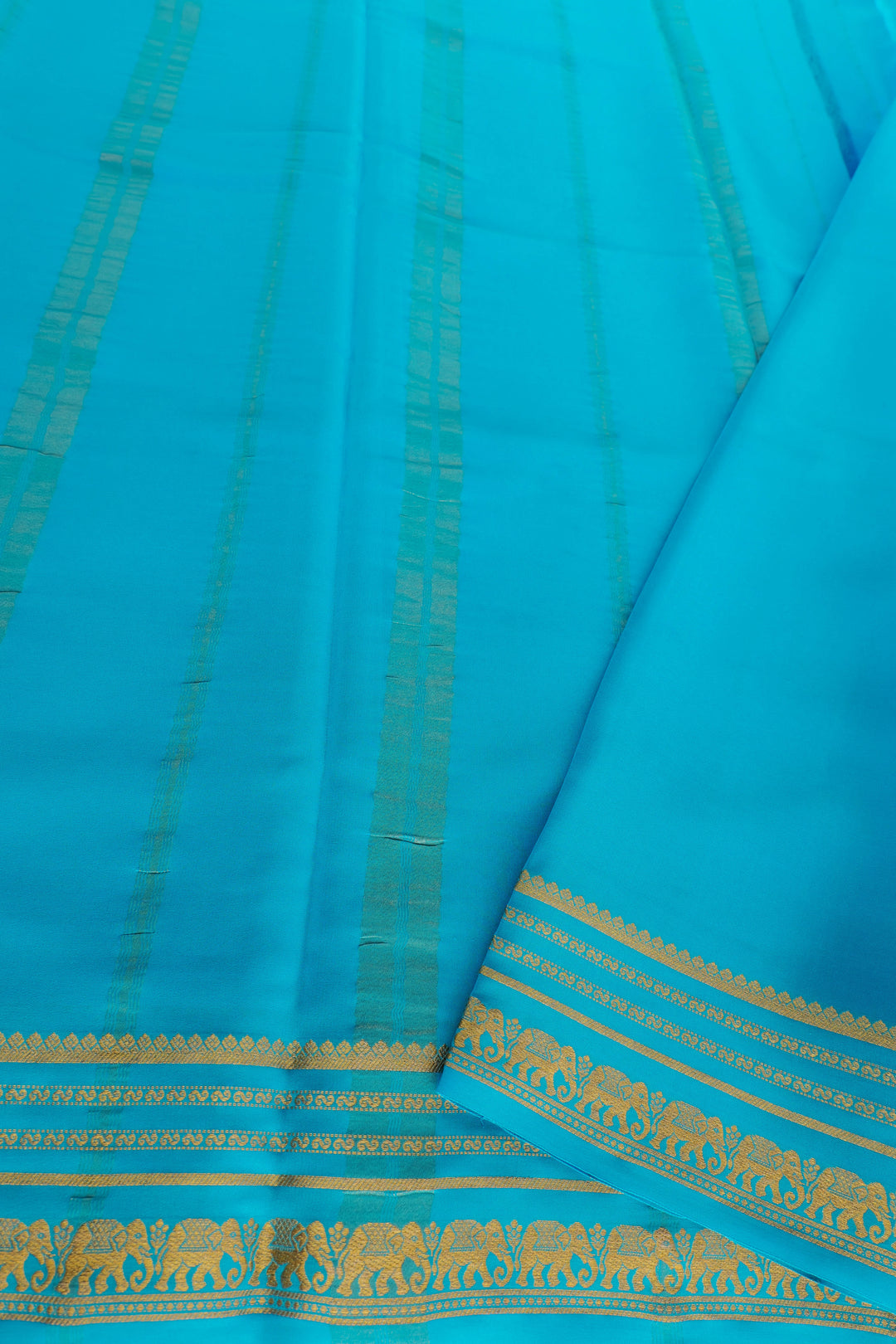 Mysore silk saree in bright turquoise blue with gold border pallu