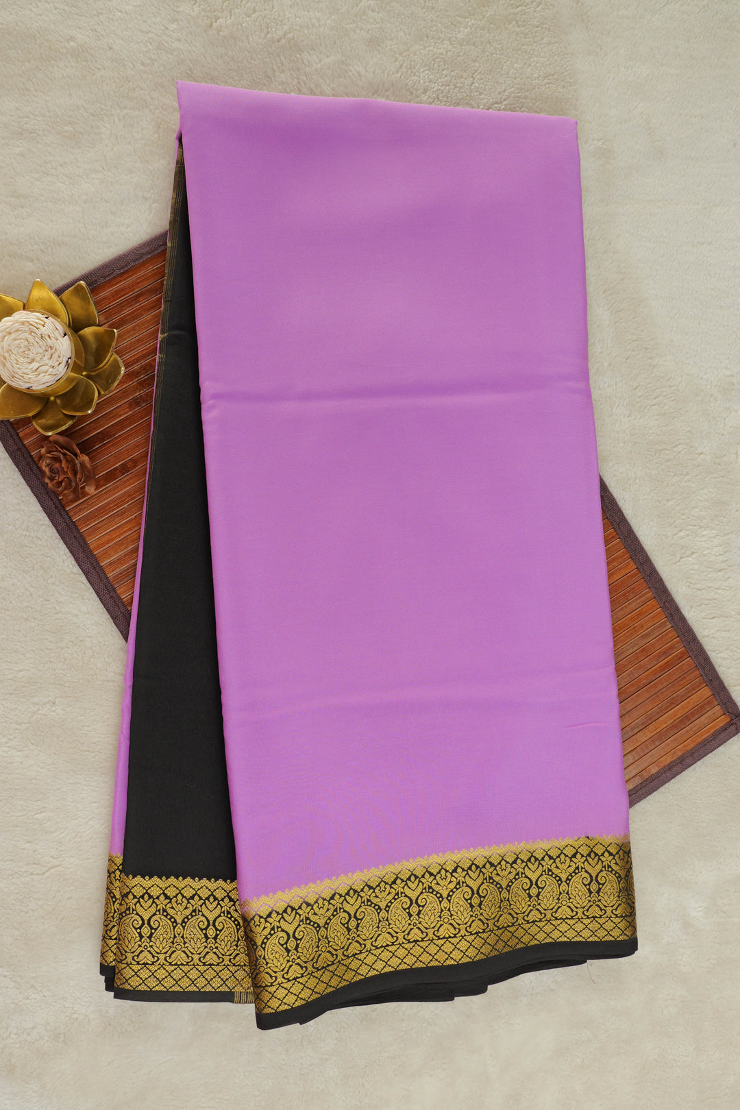Mysore silk saree with a purple body and a black border with gold zari