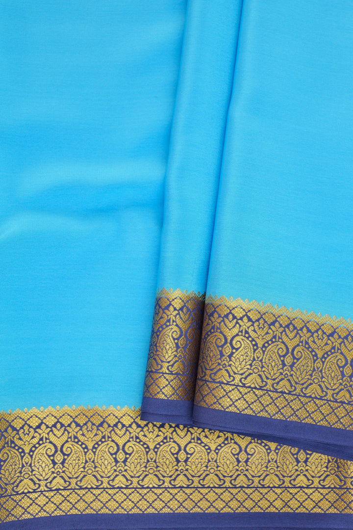 Mysore silk saree with a sky blue body and a traditional navy blue border