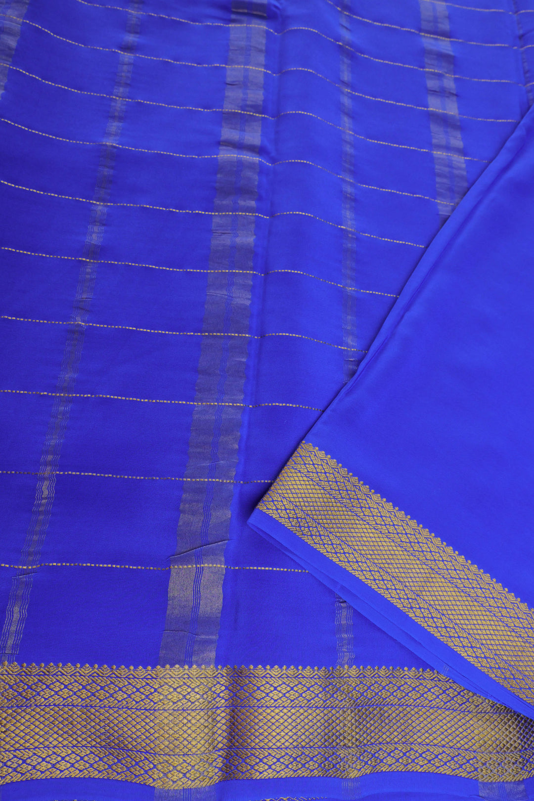 Mysore silk saree with green body, blue pallu, and zari blouse piece