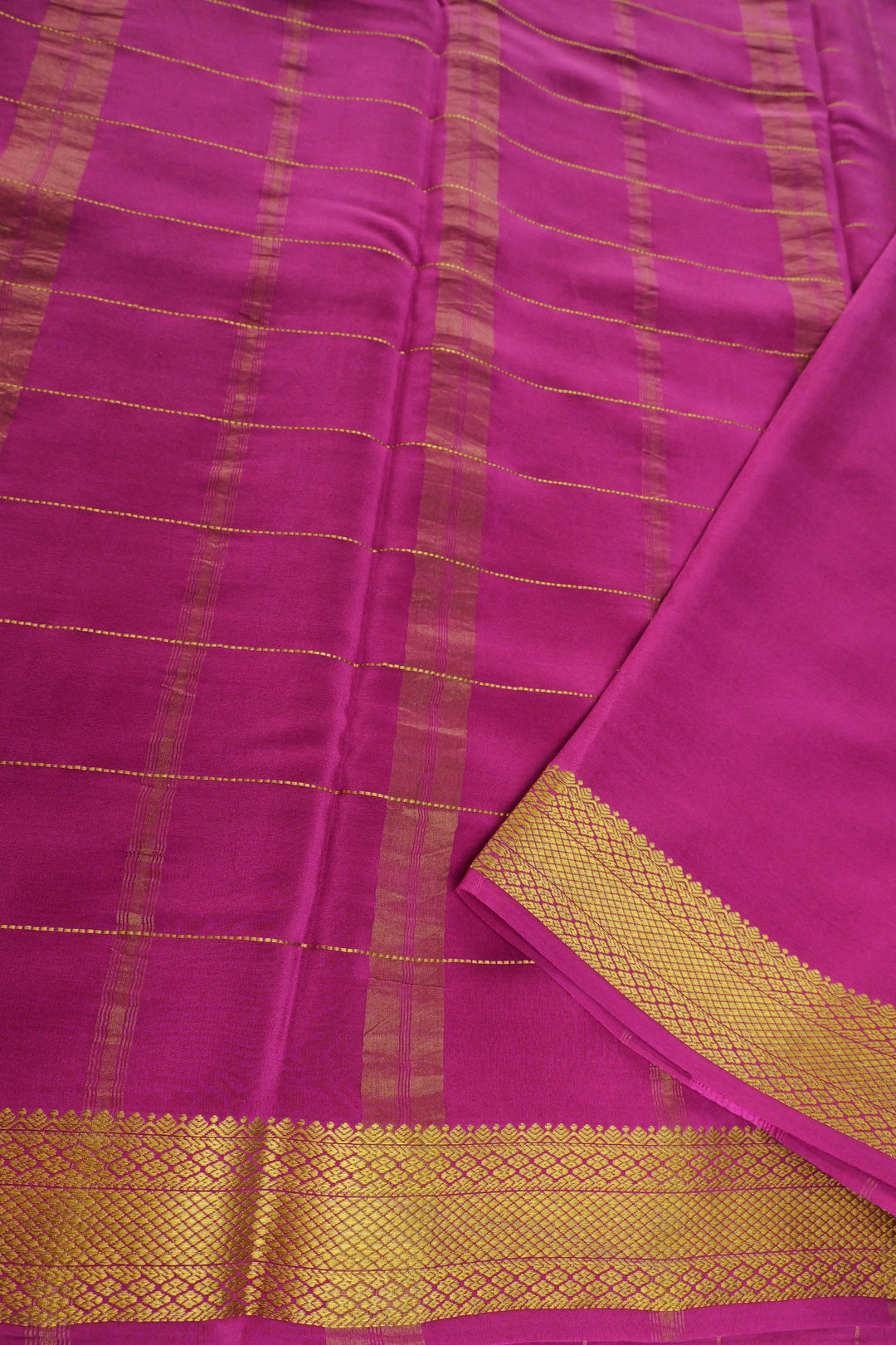 Mysore silk sarees in white paired with pink pallu and golden zari work