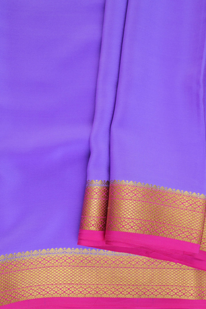 Mysoresilk saree in purple with golden zari detailing and a rich pink blouse piece