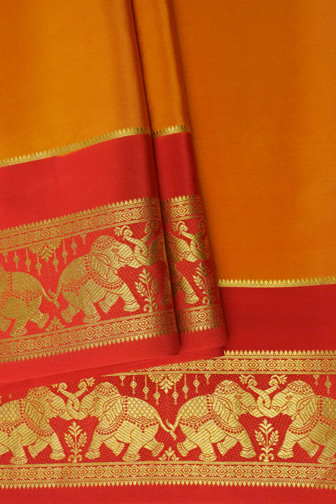 Orange Mysore Silk Saree with Red Border and Gold Elephant patterns
