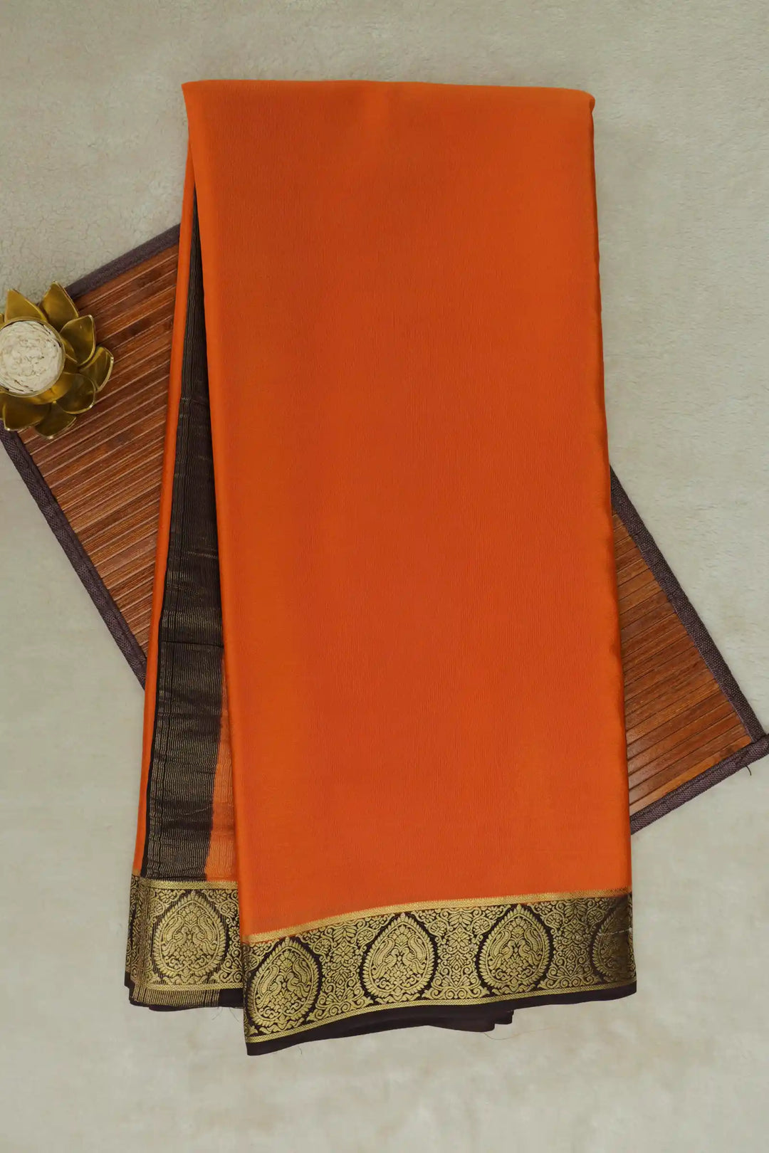 Orange Mysore Silk Saree with gold zari border and simple pallu.