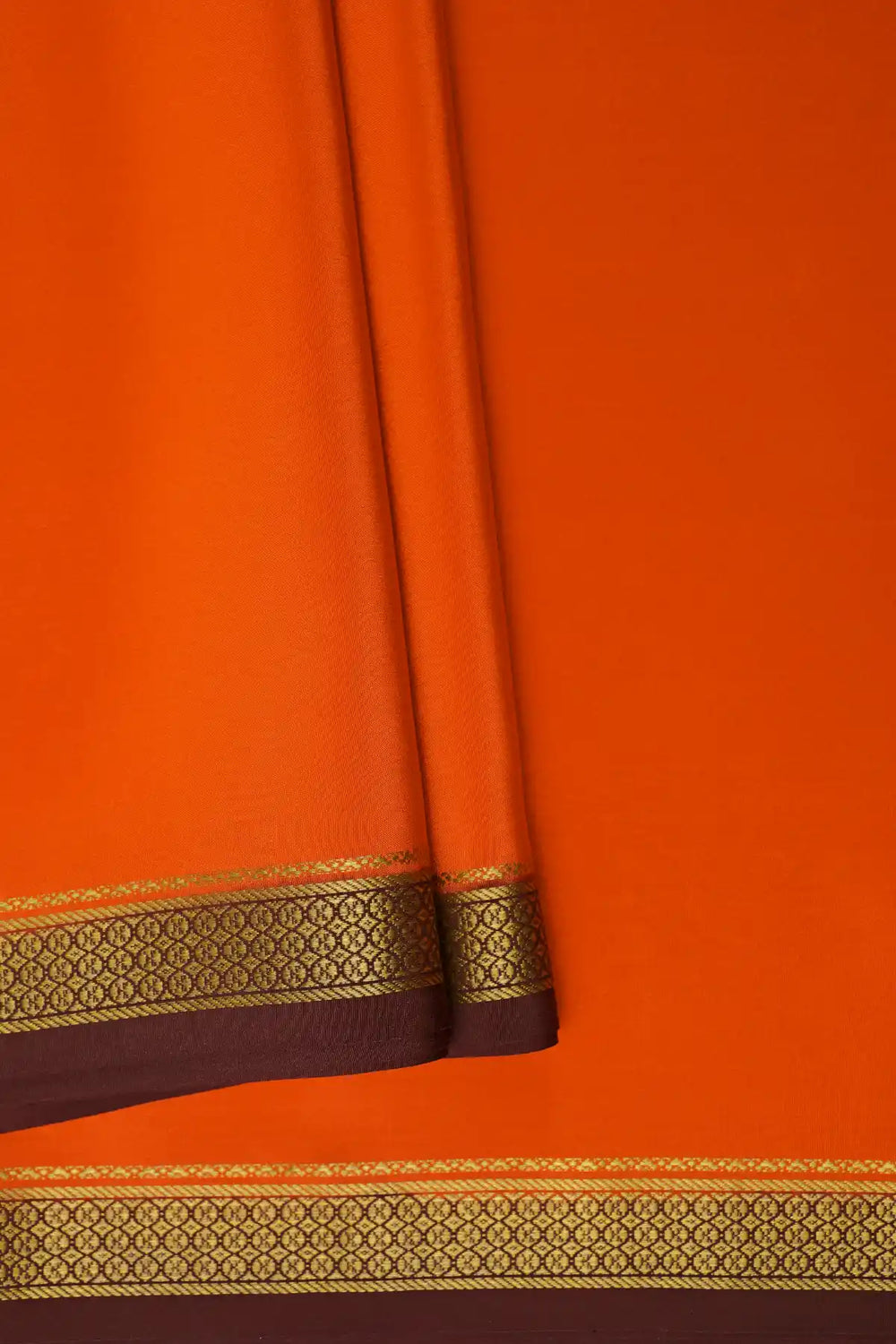 Orange Mysore saree with brown gold border