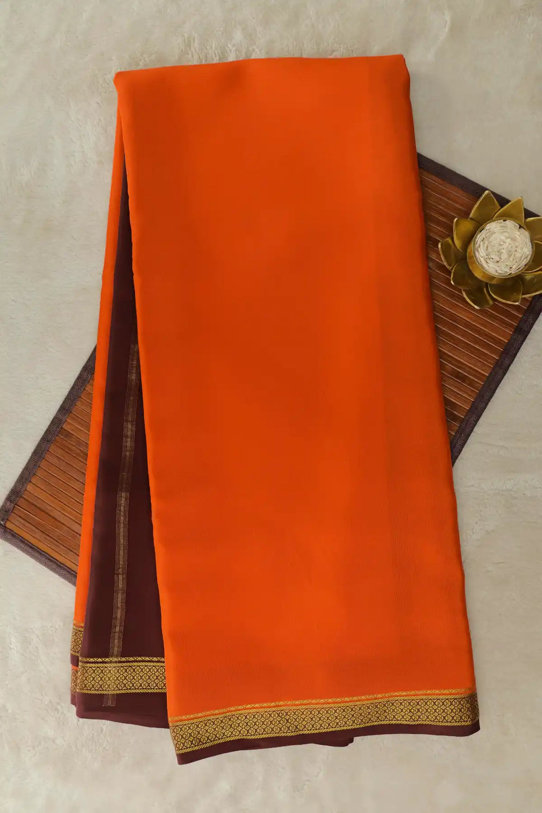 Orange pure Mysore silk saree with brown border and gold zari