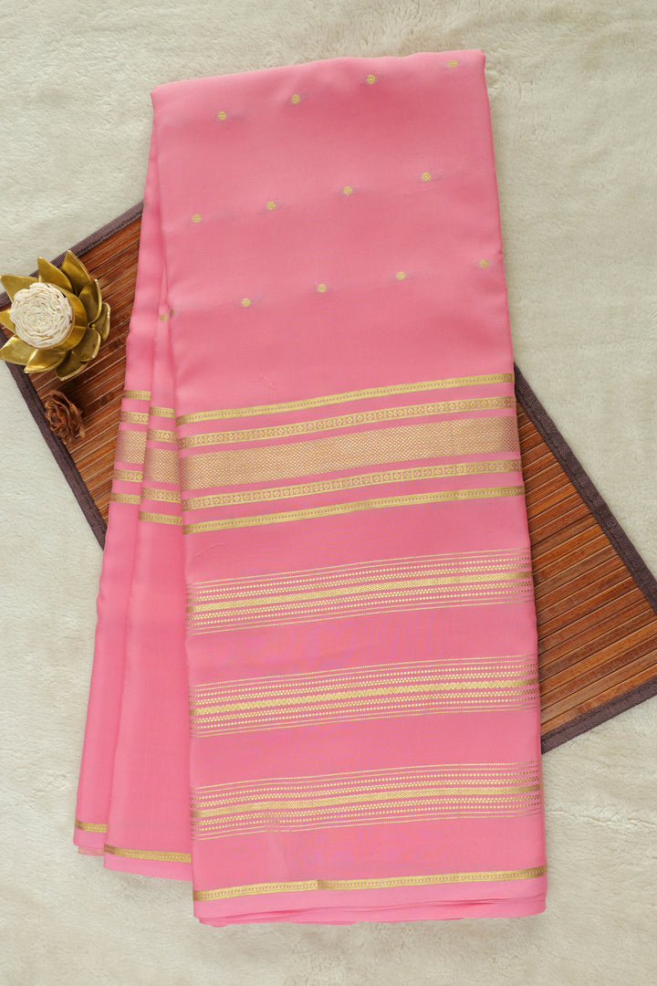 Pink Mysore silk saree with golden zari border and stripes