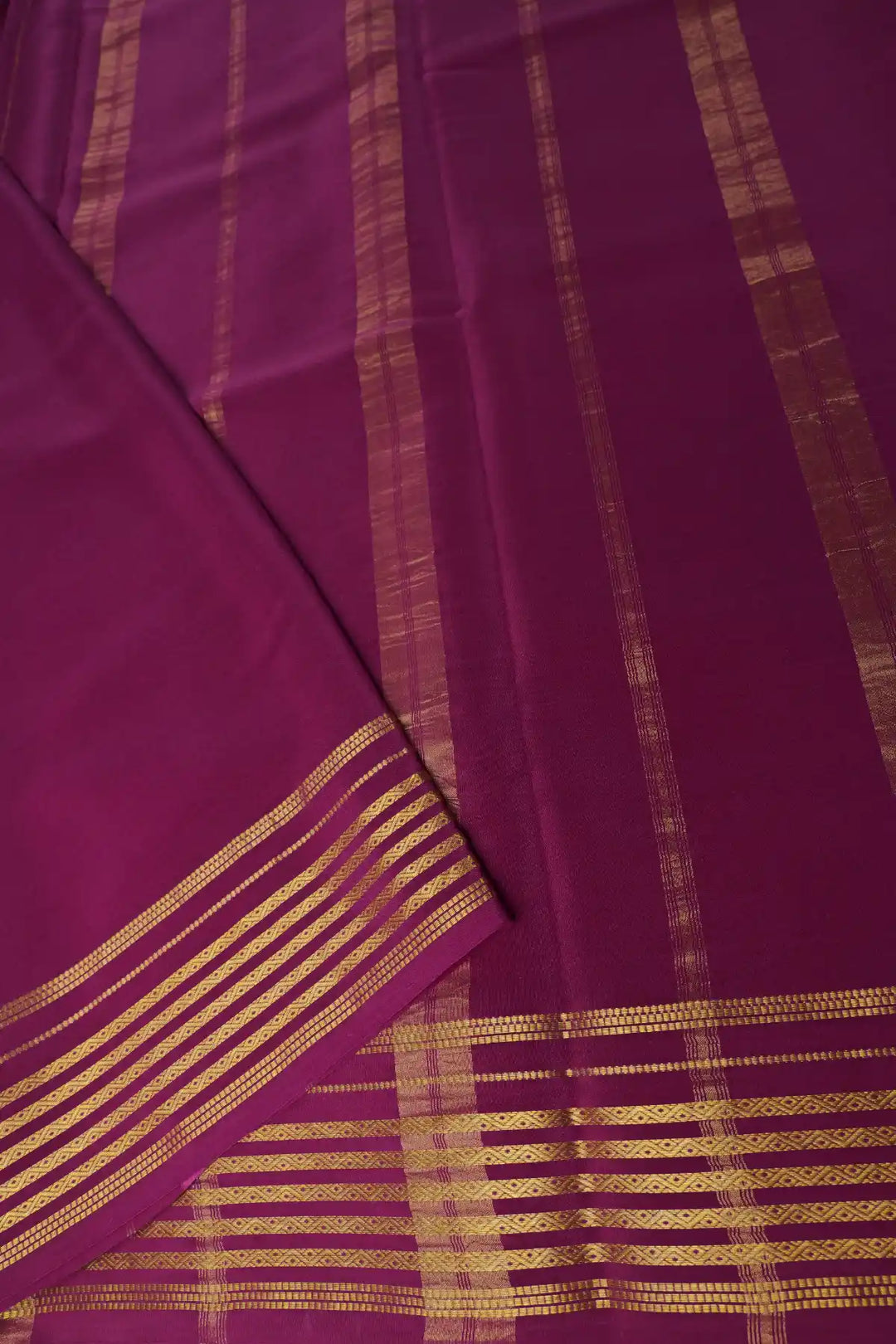 Pink saree with maroon border and golden stripes
