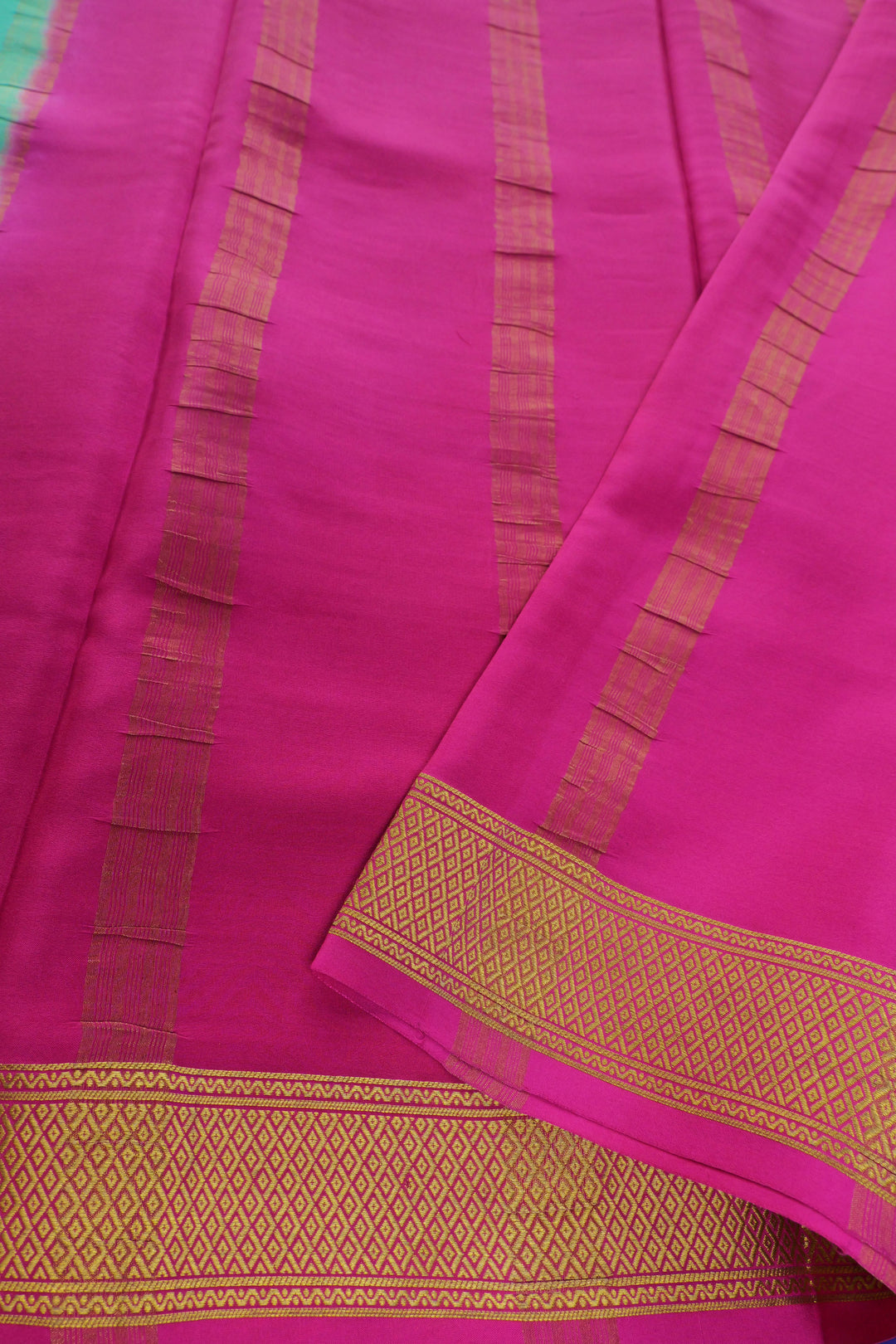 Pure Mysore silk saree in aqua blue with a contrasting hot pink stripe pallu
