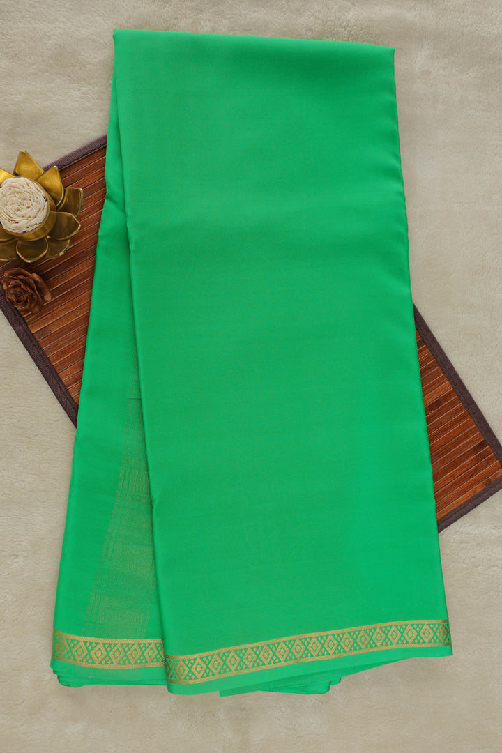 Pure Mysore silk saree in bright green with a delicate gold zari border