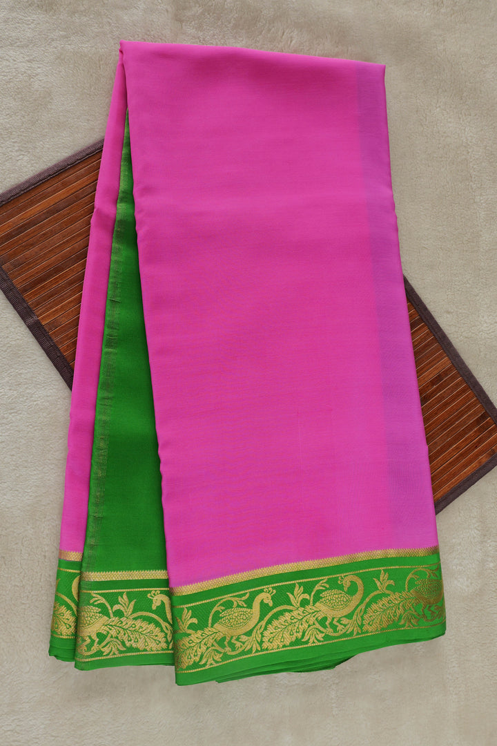 Pure Mysore silk saree in bright pink with a contrasting green and gold zari border