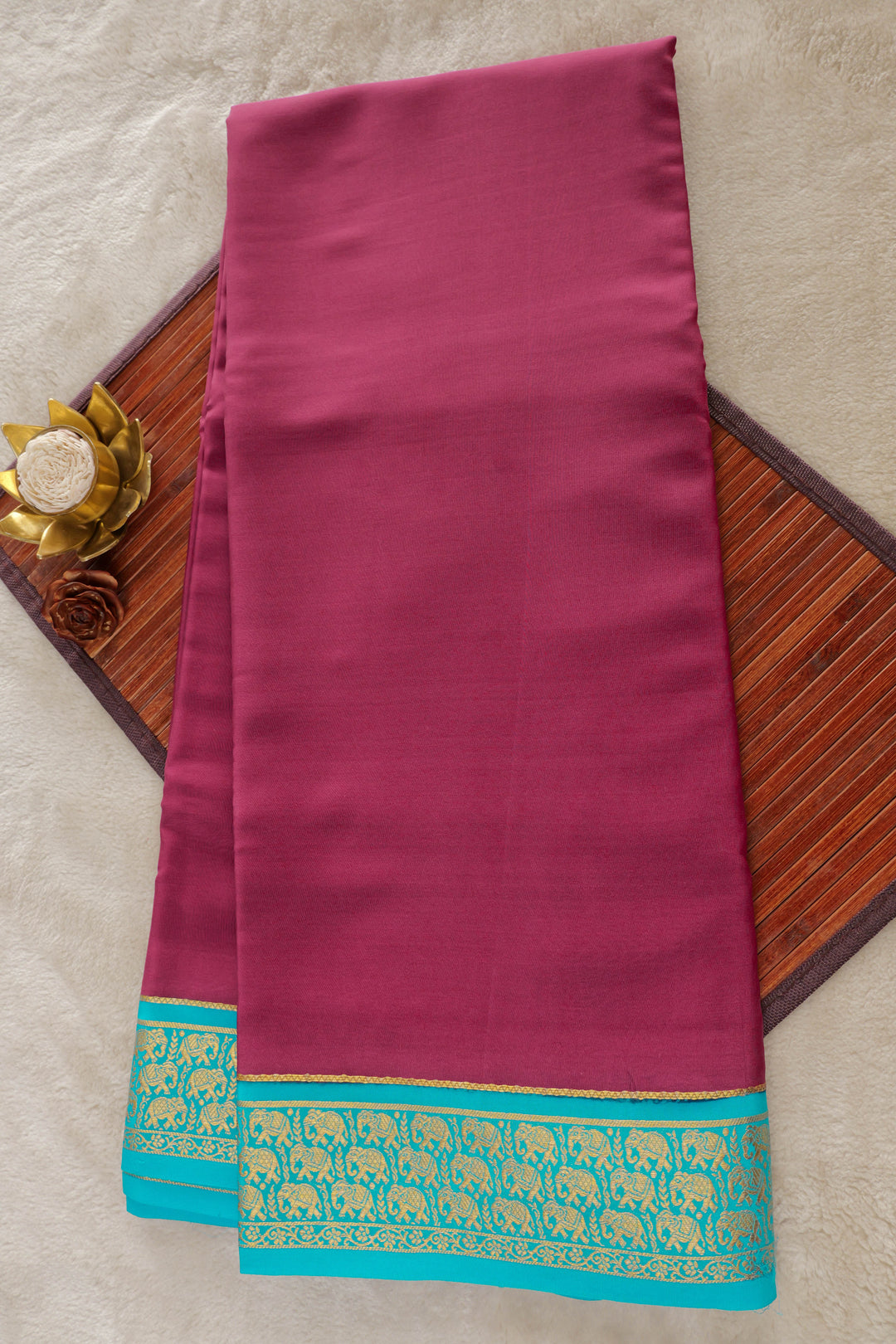 Pure Mysore silk saree in deep purple with turquoise blue border and gold elephant motifs