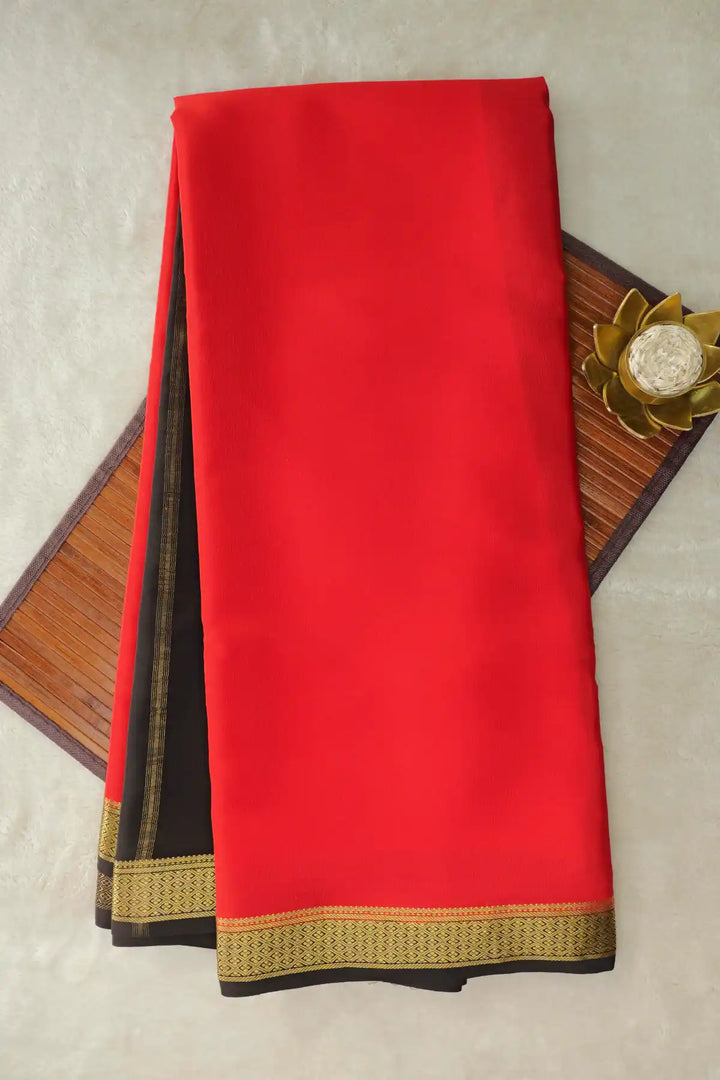 Pure Mysore silk saree in orange with black gold border