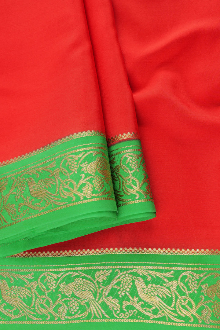 Pure Mysore silk saree in red with golden parrot embroidery on a green border