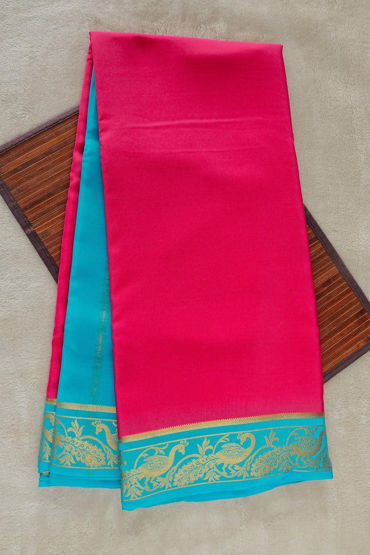 Pure Mysore silk saree in rich pink with a contrasting turquoise blue border