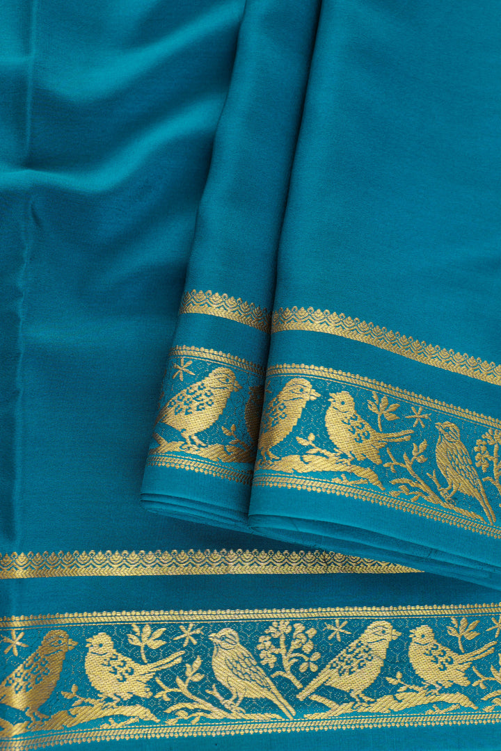 Pure Mysore silk saree in teal blue with traditional gold zari detailing