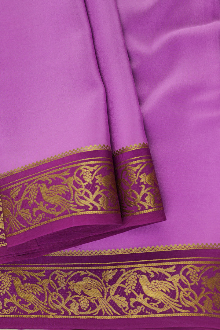 Pure Mysore silk saree in vibrant purple with traditional golden embroidery