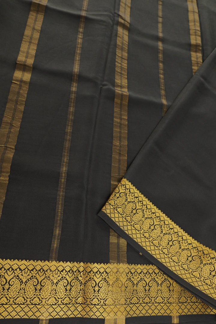 Purple Mysore silk saree with a contrasting black pallu and a gold border